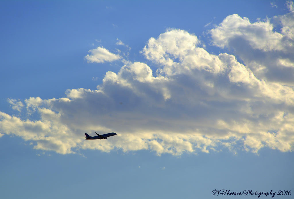 Airplane in the Clouds 7-22-2016.jpg