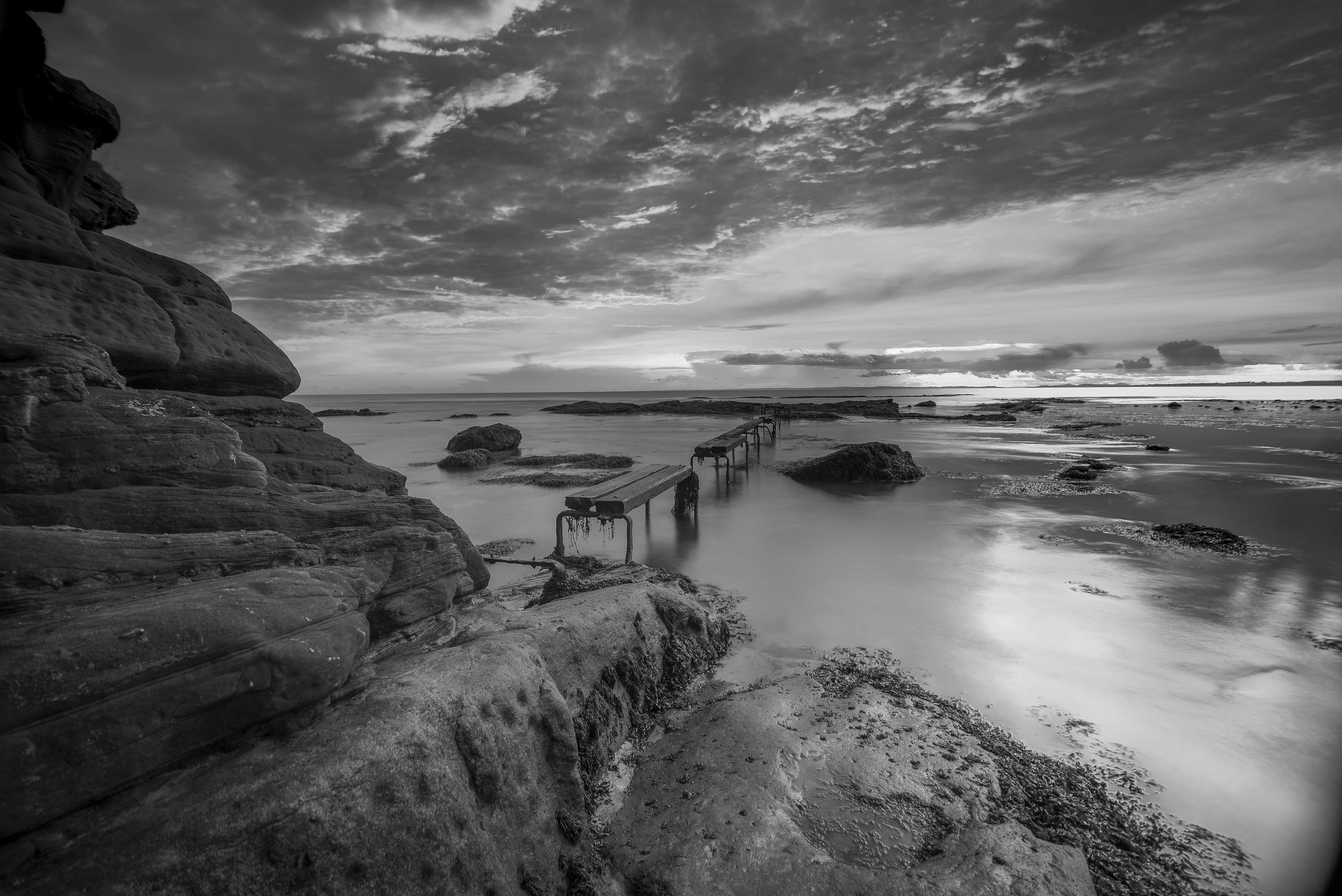 cliff jetty sunset b&w.jpg