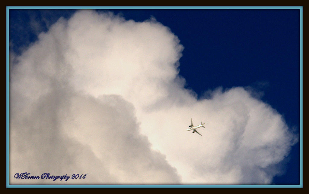 Plane Going into Cloud with frame.jpg