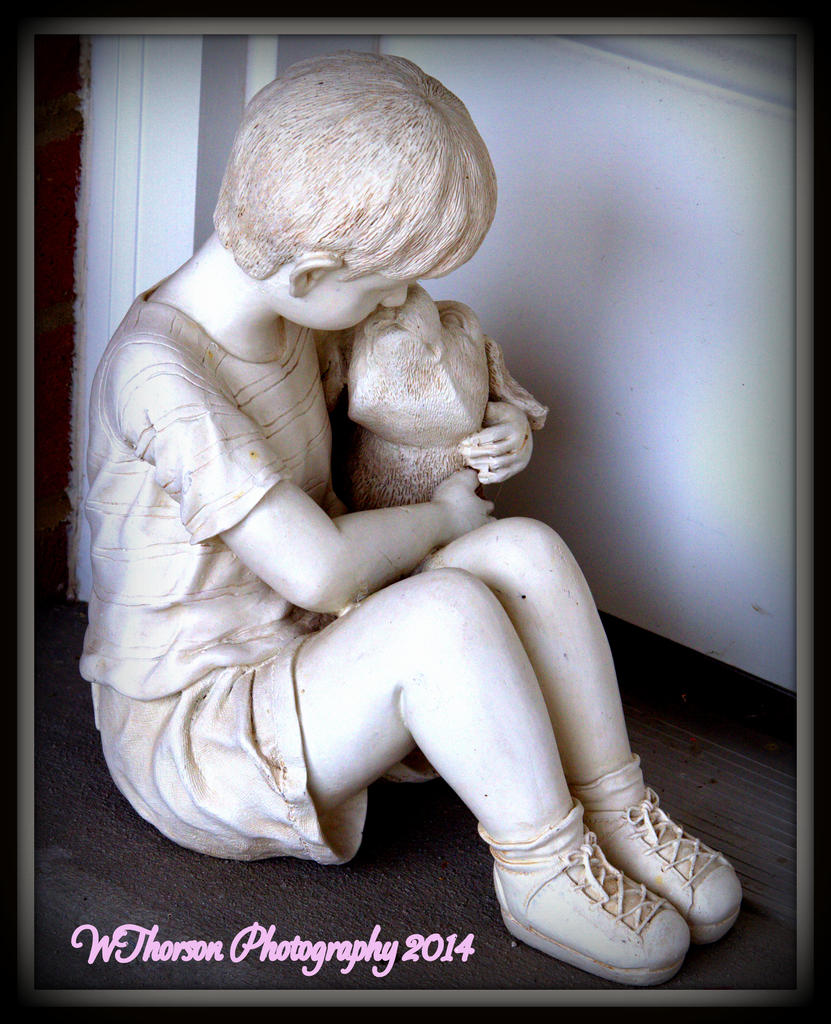 Statue of a boy and a dog.jpg