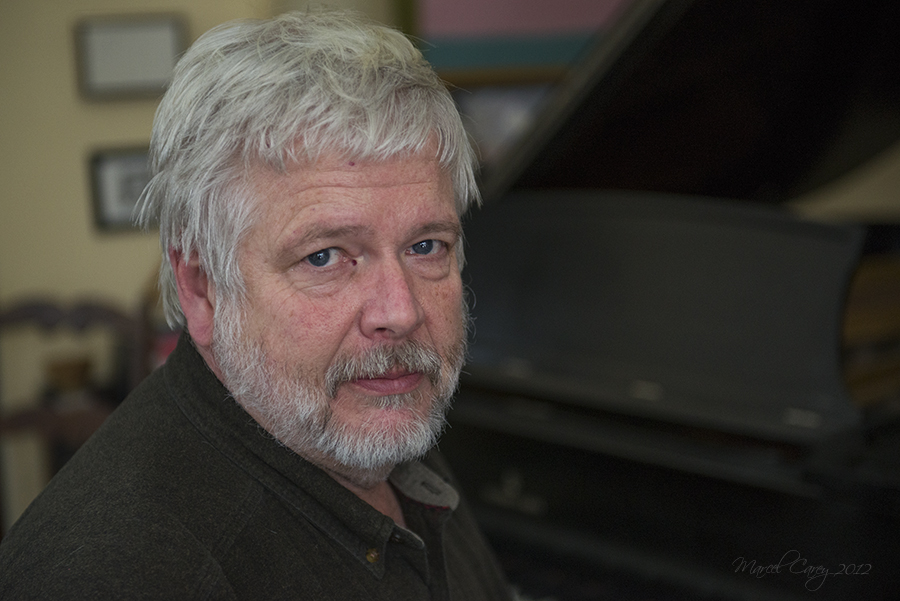 Tim D with piano.jpg
