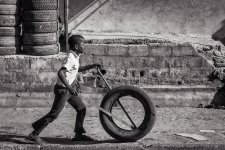 a boy with a tire B&W.jpg