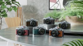 six_different_colors_of_the_nikon_z_f_are_placed_on_a_round_table_surrounded_by_plants_and_art.jpeg